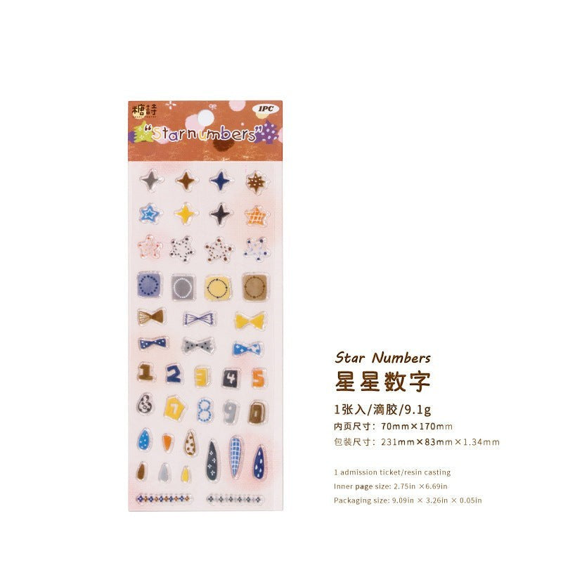 StationeryHaul decorative adhesive sticker sheet featuring colorful star and number motifs on a transparent backing.