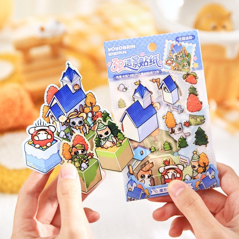 StationeryHaul 3D scene sticker pack with cute cat characters, blue houses, trees, and autumn leaves. PVC material.