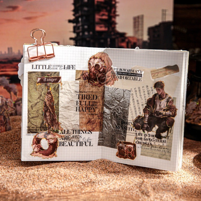 StationeryHaul Apocalyptic Wasteland Character Sticker Pack featuring gas mask, survivor, and distressed text elements on a journal.