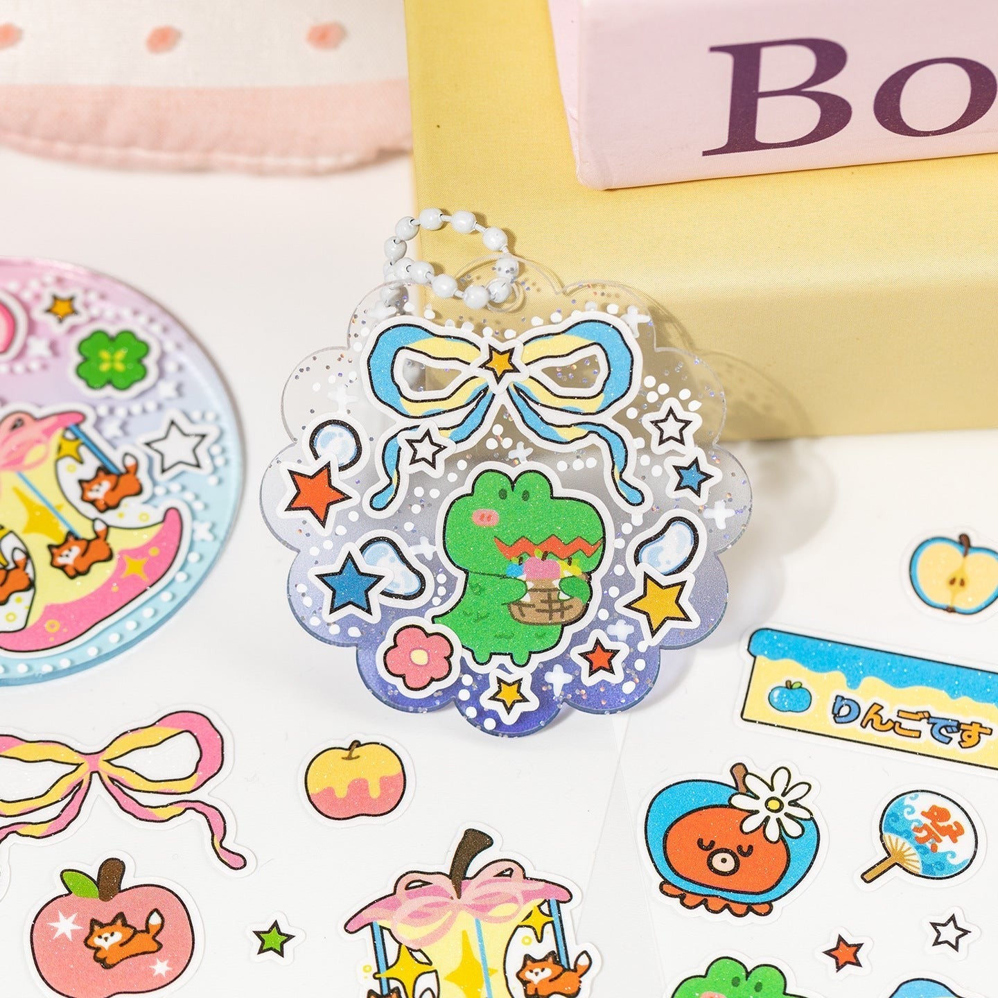 StationeryHaul cute apple shaped sticker sheets with kawaii animals and bows. Features a green alligator charm.