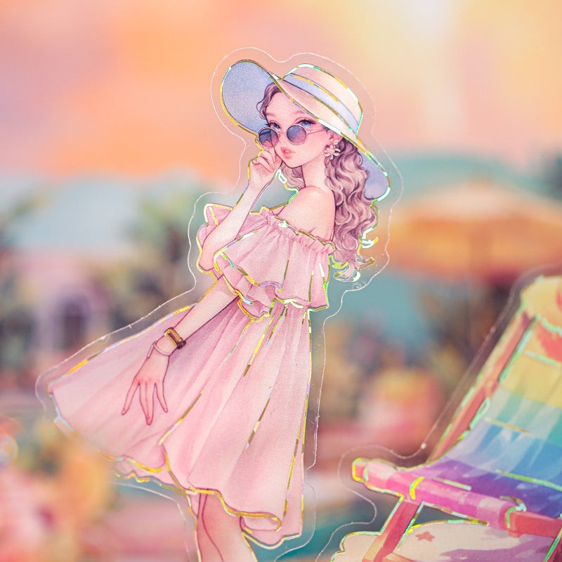 StationeryHaul clear holographic stickers of a woman in a pink dress and sun hat on a beach vacation.