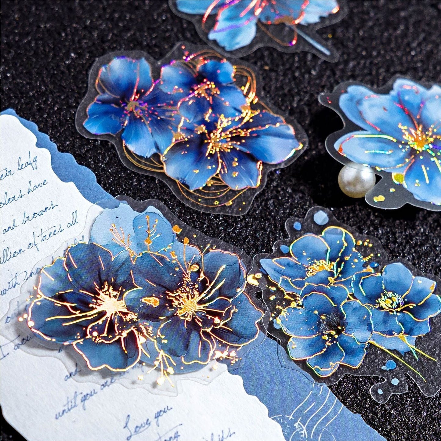 StationeryHaul floral PET stickers with blue petals and gold foil accents for journal decoration and scrapbooking.