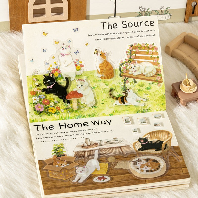 StationeryHaul transparent cat stickers featuring various breeds and scenes like cats playing in flowers, on a bench, and relaxing indoors.