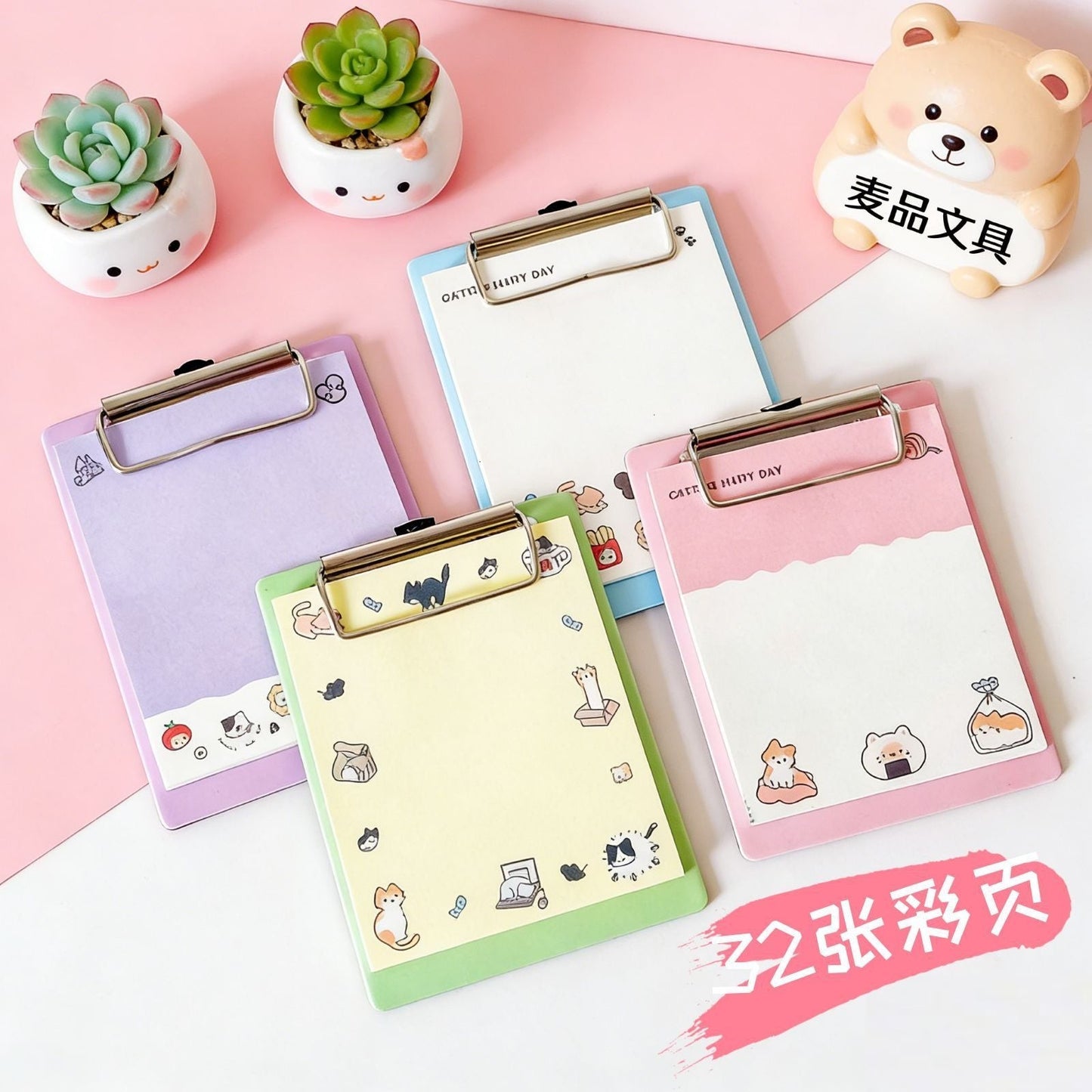 StationeryHaul cute bear-themed clipboard memo pads with colorful illustrated pages and metal clips on a pink desk.