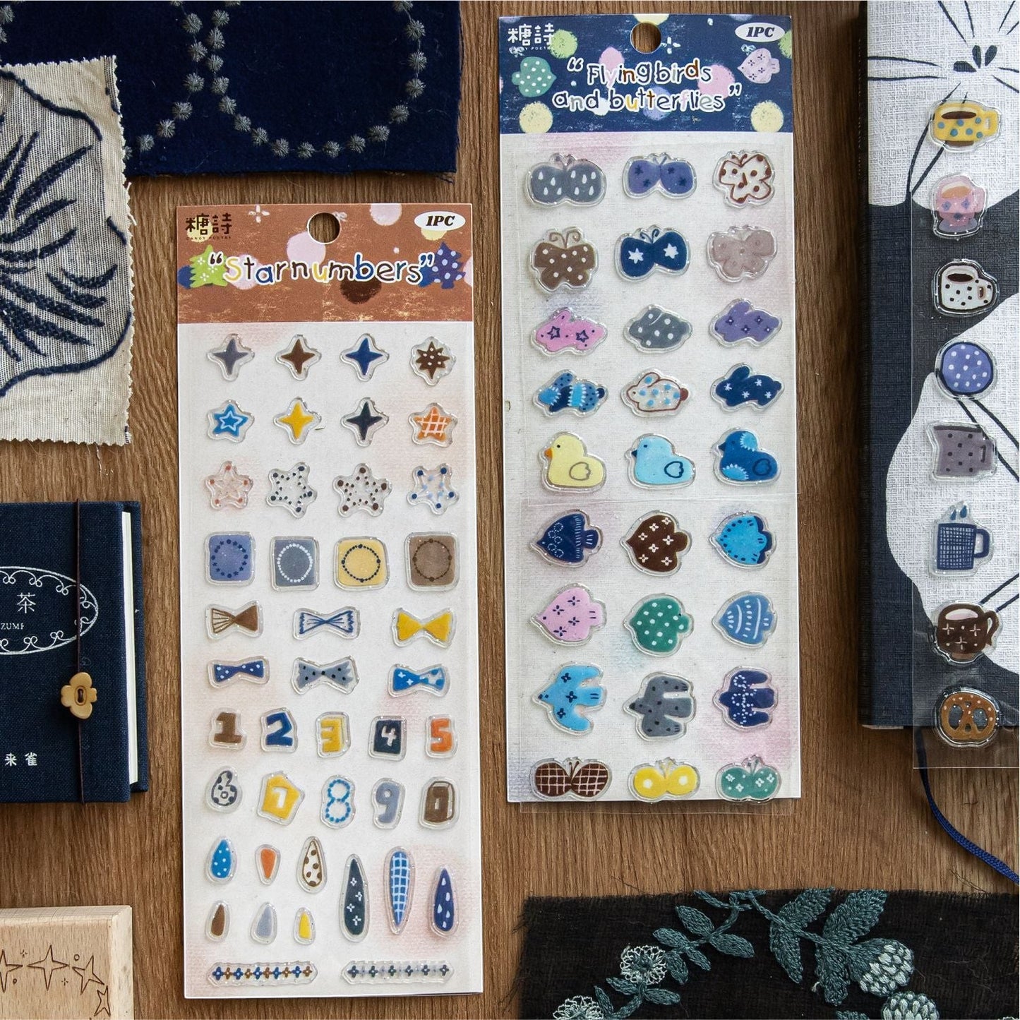 StationeryHaul decorative sticker sheets featuring star, number, bird, and butterfly motifs on transparent backing.