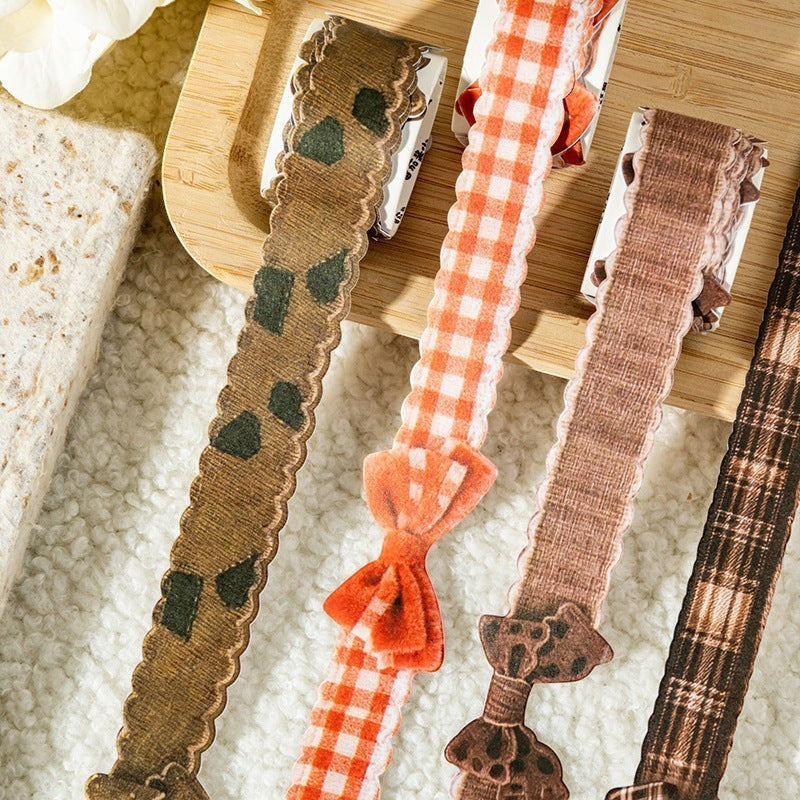 StationeryHaul decorative craft ribbons with scalloped edges, plaid patterns, and attached bows for scrapbooking.