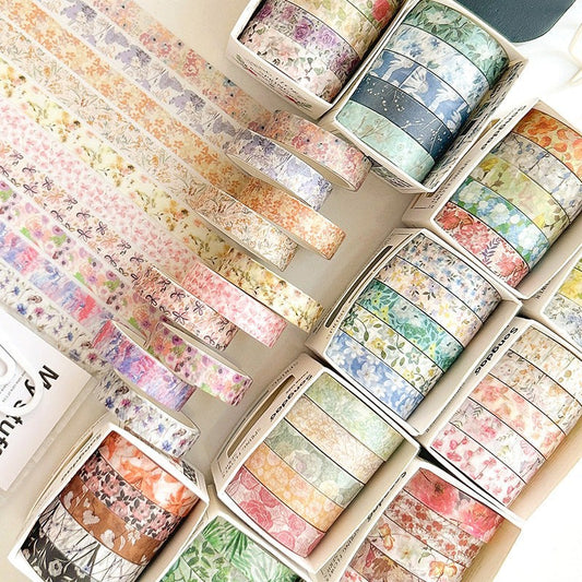 StationeryHaul floral washi tape set featuring various pastel spring flower patterns on paper rolls for scrapbooking