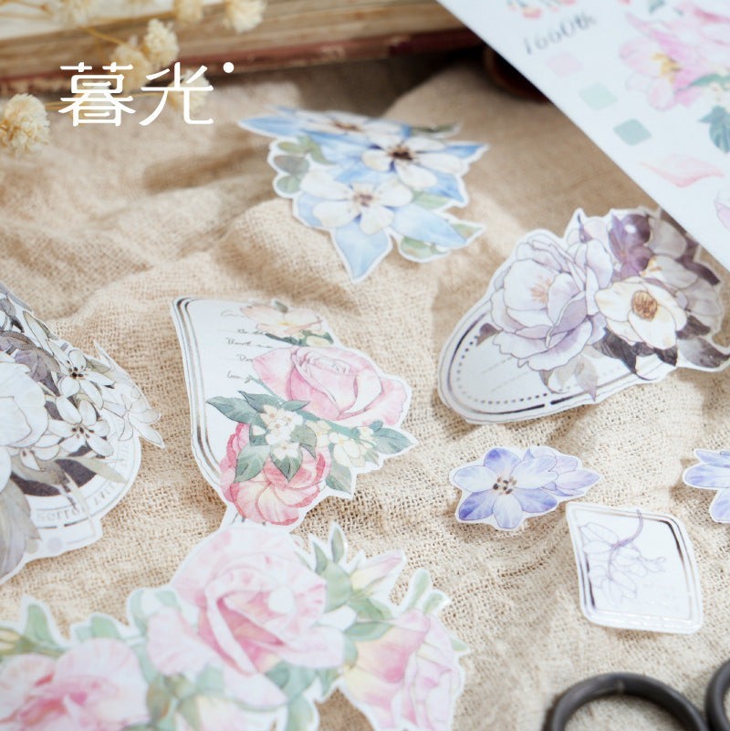 StationeryHaul watercolor floral washi tape and stickers in blue, pink, and purple hues with vintage script accents.