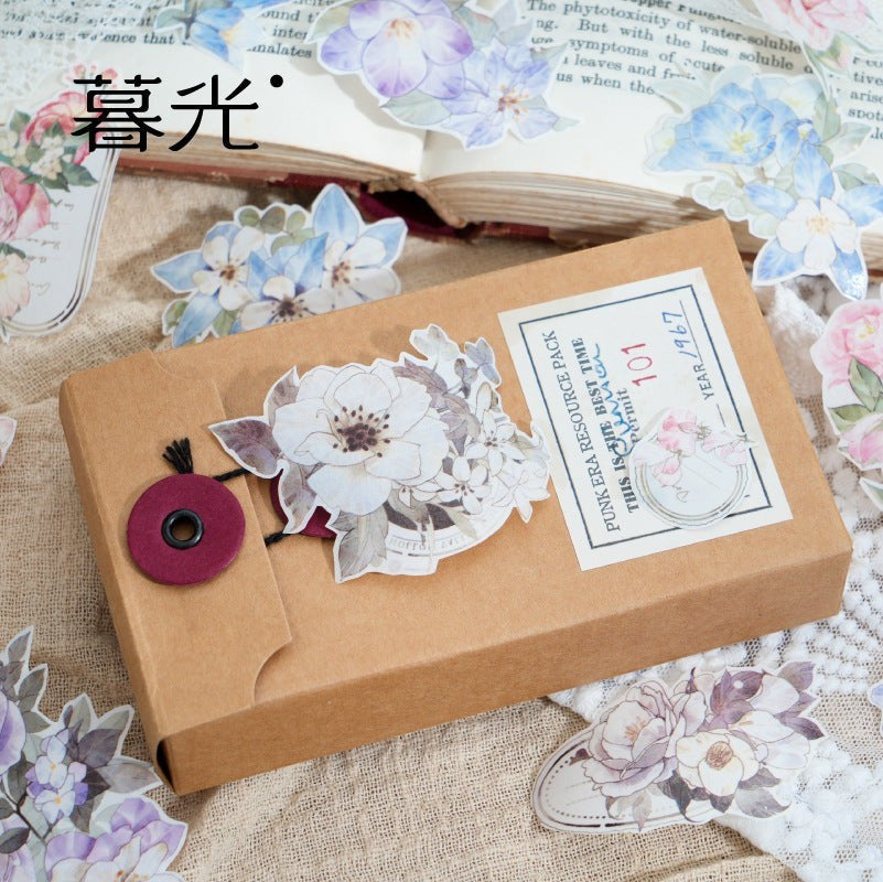 StationeryHaul floral washi tape and sticker set with blue and pink watercolor blossoms and vintage script on a kraft box.
