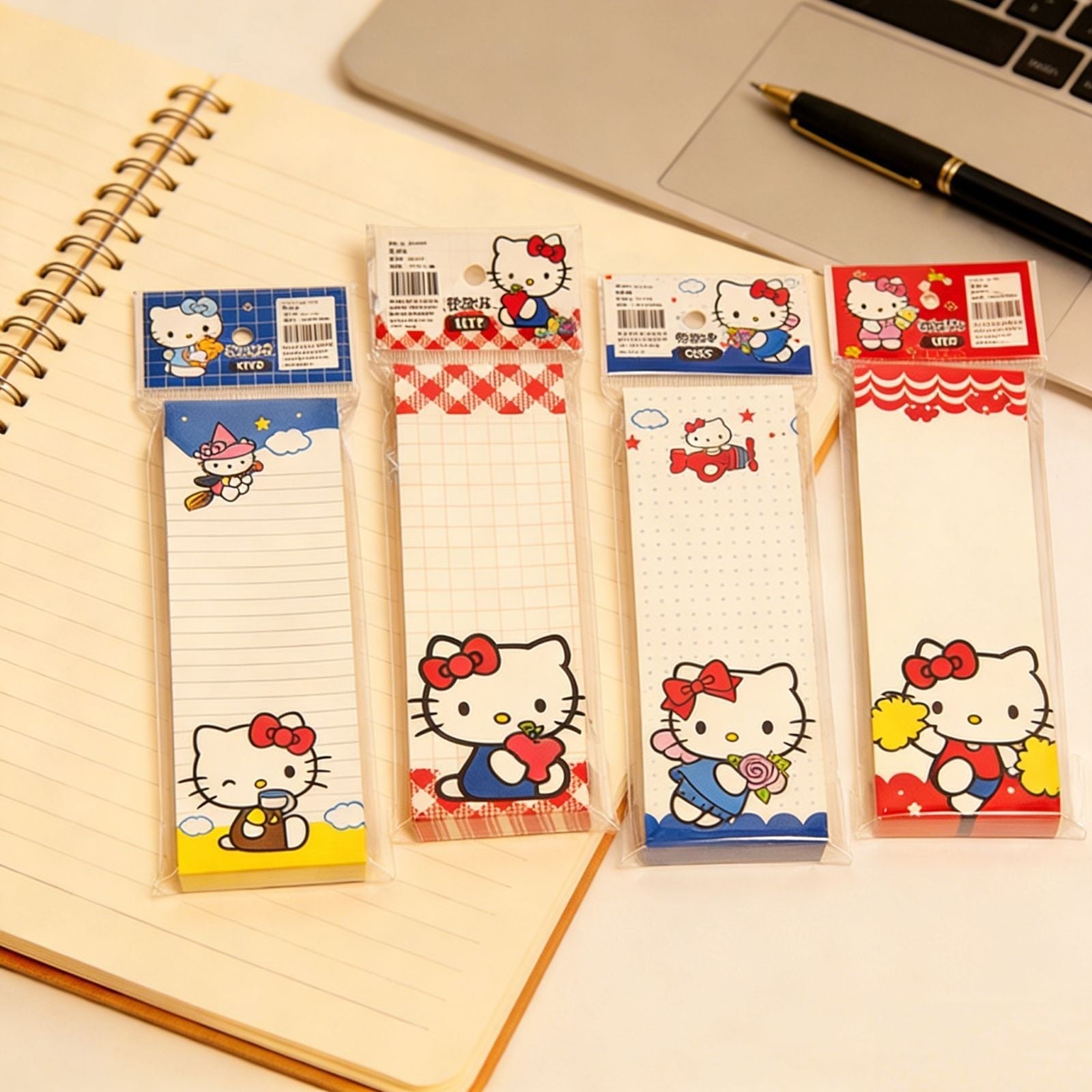 StationeryHaul Hello Kitty long memo pads with colorful character designs and lined or grid paper on a notebook