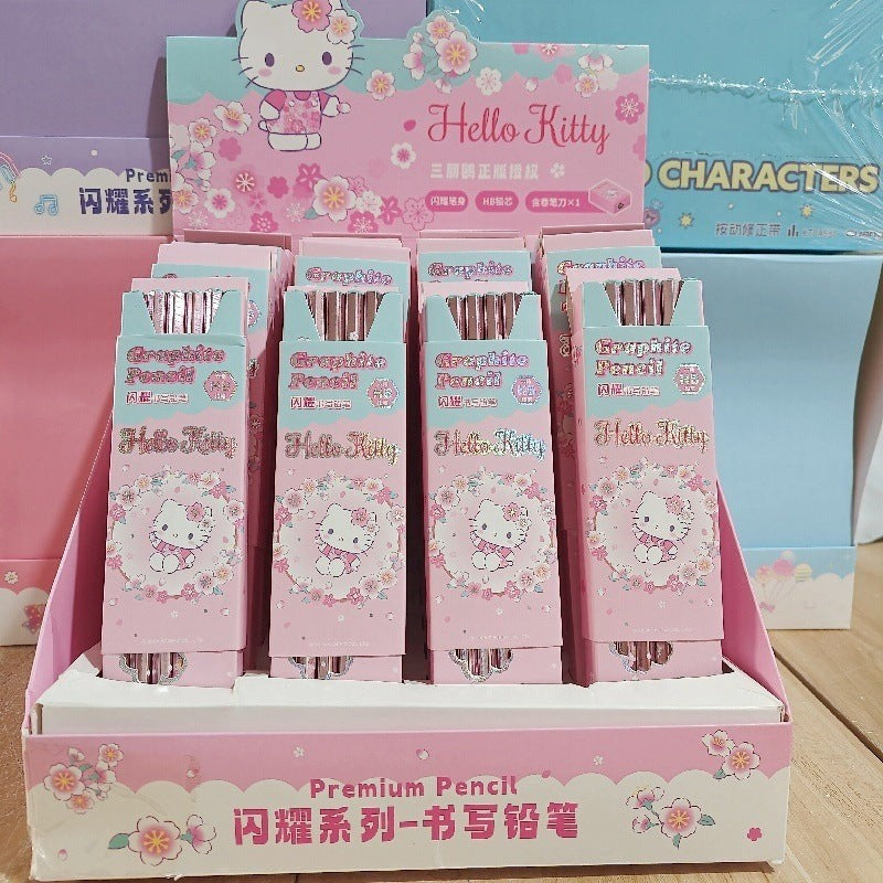 StationeryHaul Hello Kitty pearlescent HB graphite pencil boxes in a pink floral display stand for children