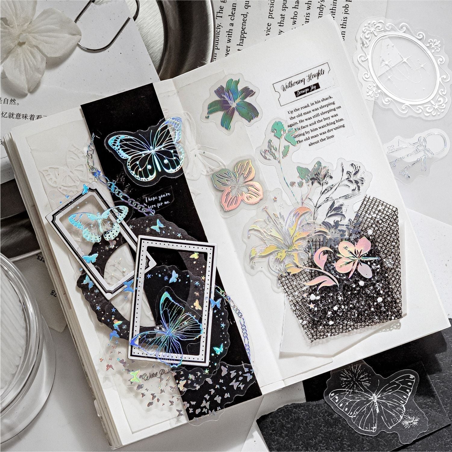 StationeryHaul iridescent butterfly and floral decorative stickers on transparent material for journals and crafts.