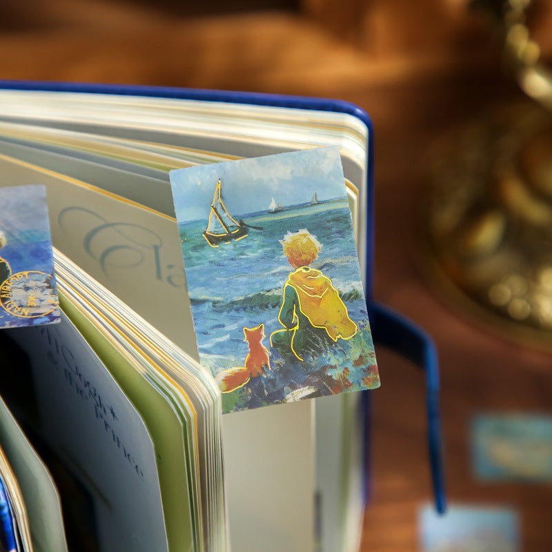 StationeryHaul The Little Prince sticker with gold foil outline of boy and fox by the sea, inspired by Van Gogh.