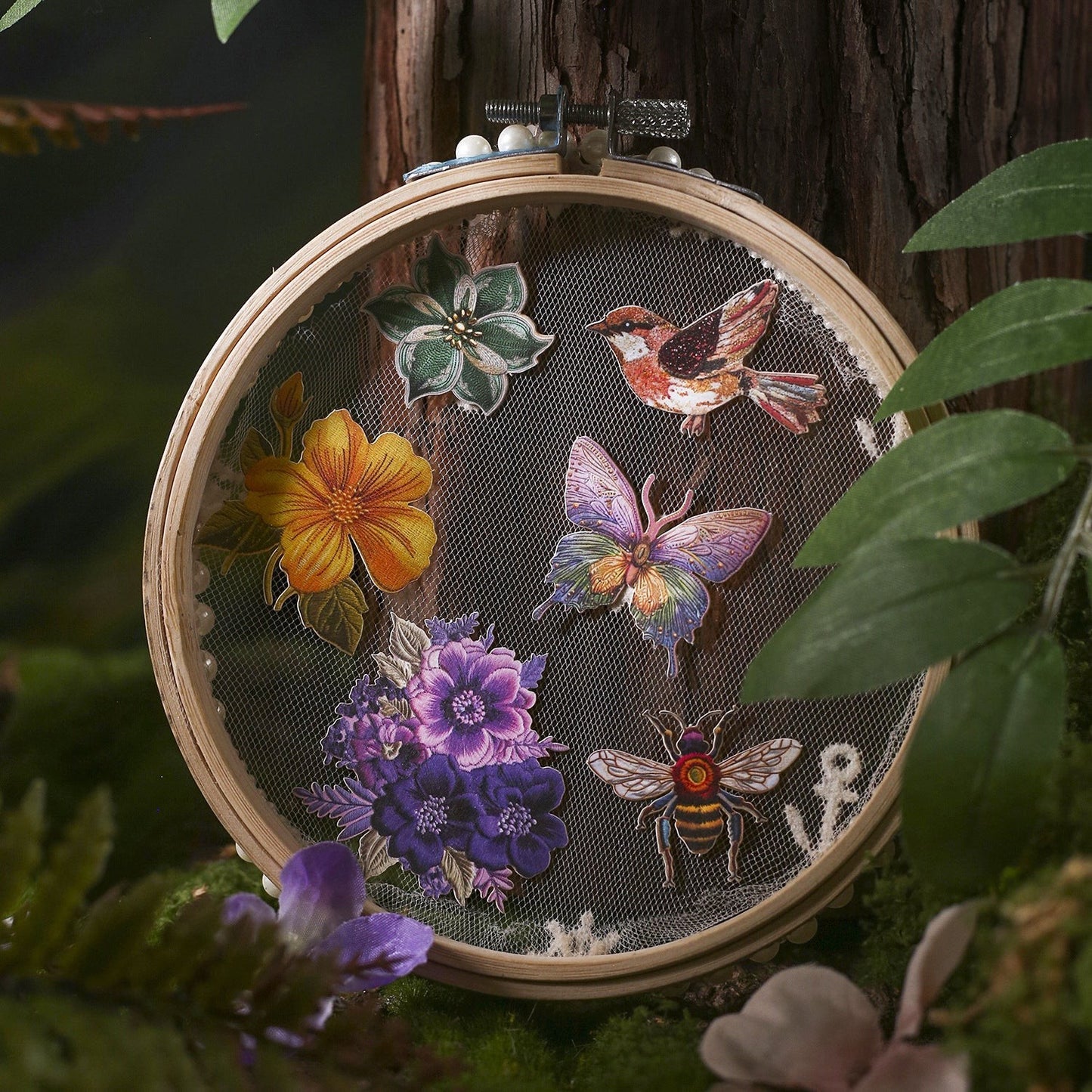 StationeryHaul nature-inspired decorative stickers featuring a yellow flower, purple flowers, a butterfly, a bee, a bird, and a green flower.