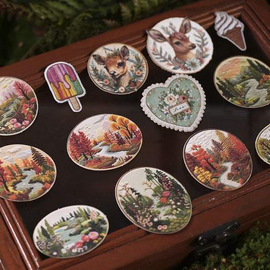 StationeryHaul nature-inspired embroidered stickers: deer, forest scenes, ice cream, and floral heart with 'love'.