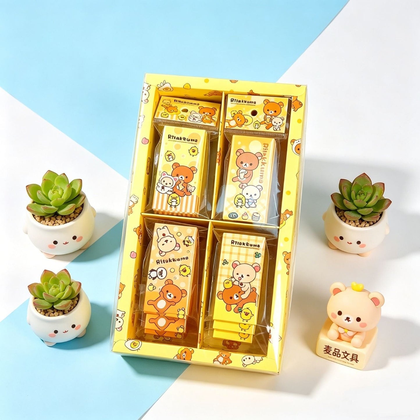StationeryHaul Rilakkuma themed stationery gift set with four yellow patterned notebooks in a clear display box.