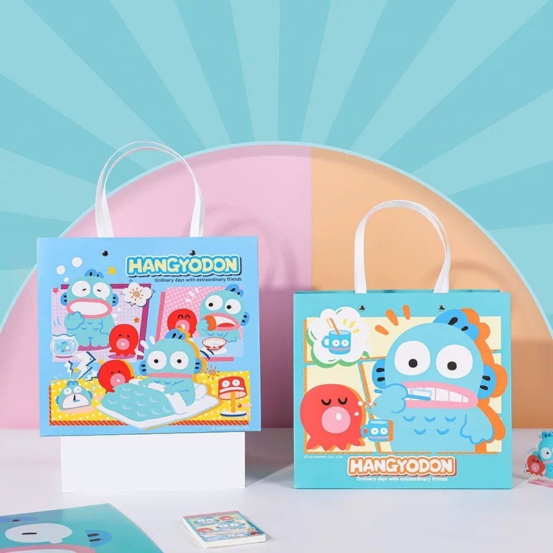 StationeryHaul blue paper gift bags with Hangyodon character designs and white handles. Set of 2.