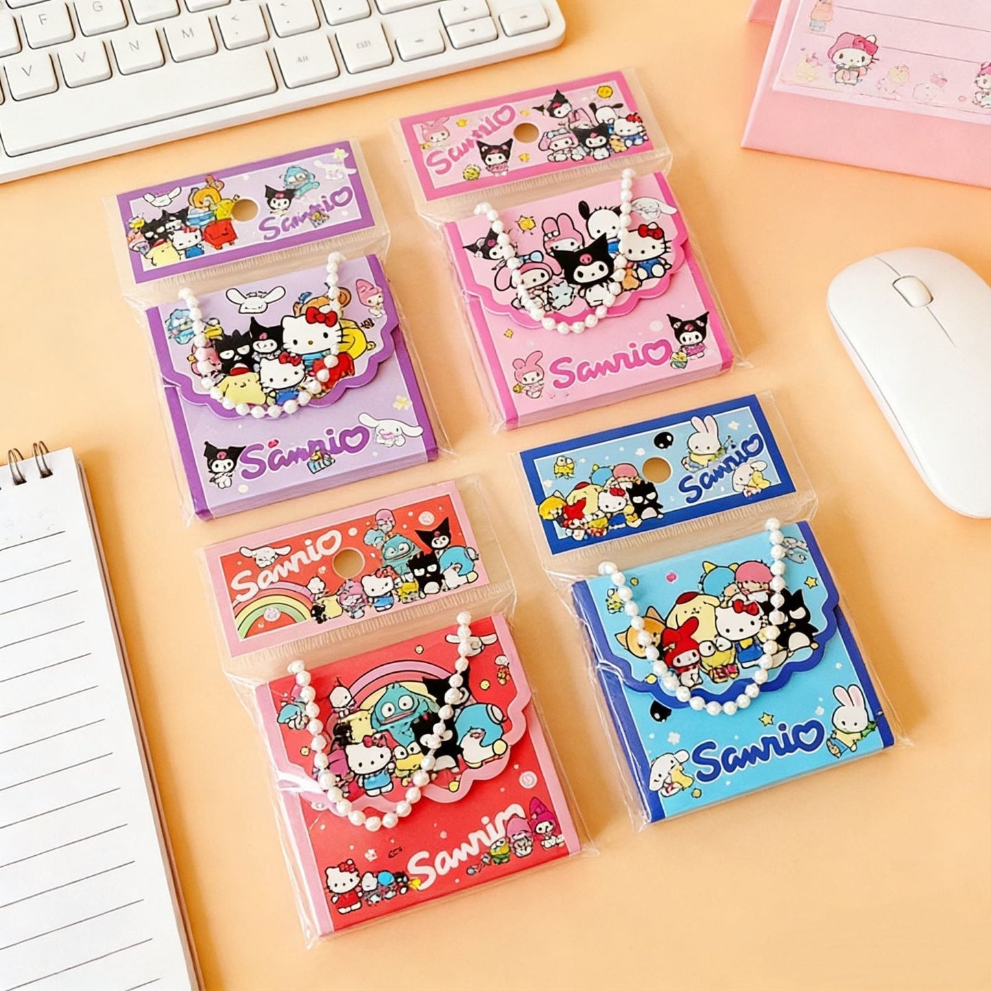 StationeryHaul Sanrio character memo note pads in colorful tote bag style packaging with pearl chain handles.