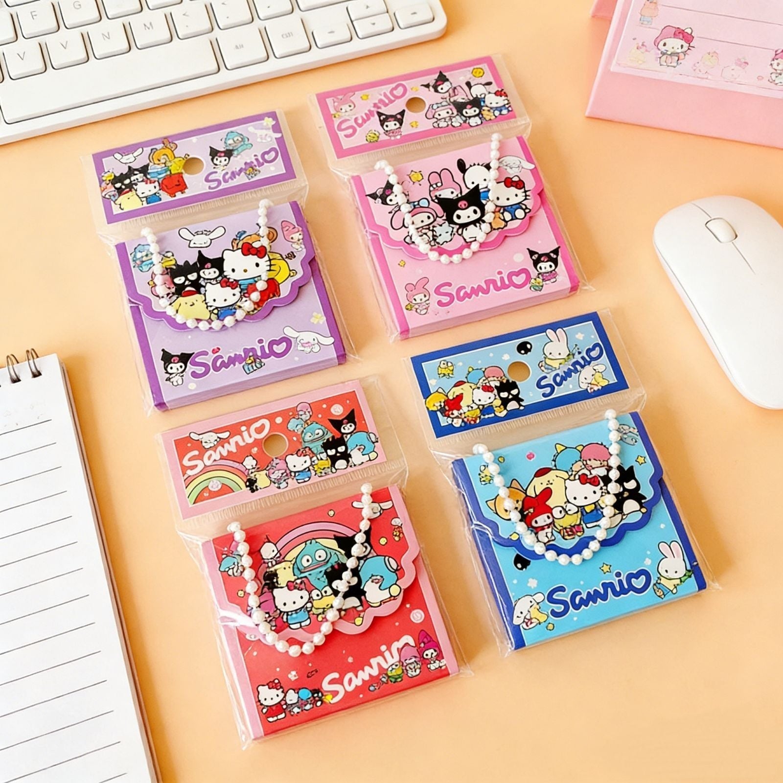 StationeryHaul Sanrio character memo note pads in colorful tote bag style packaging with pearl chain handles.