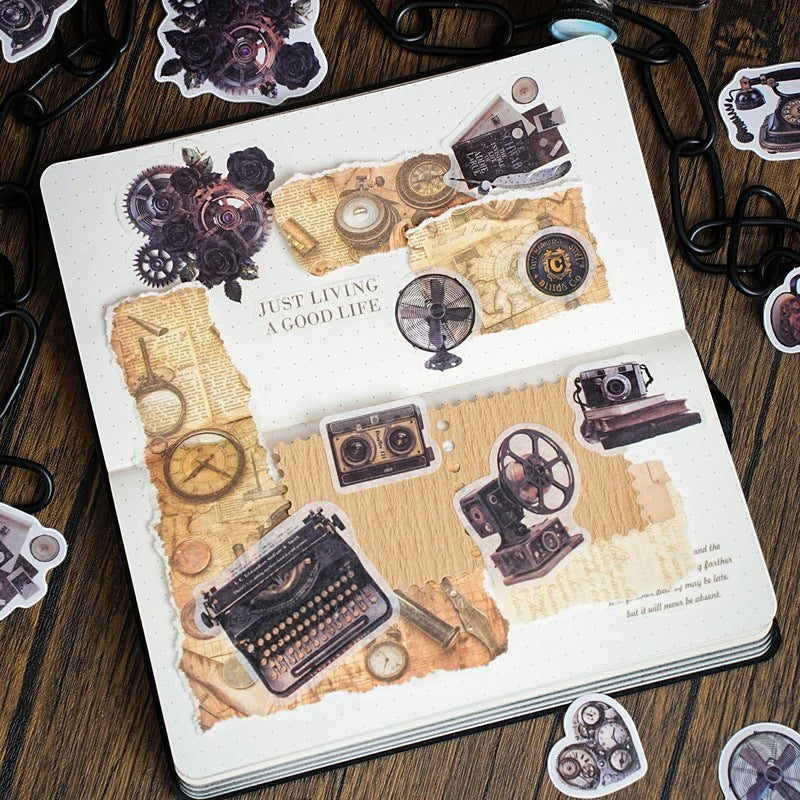 StationeryHaul Vintage Steampunk Decorative Sticker Set featuring a typewriter, cameras, gears, and roses in muted browns and grays.