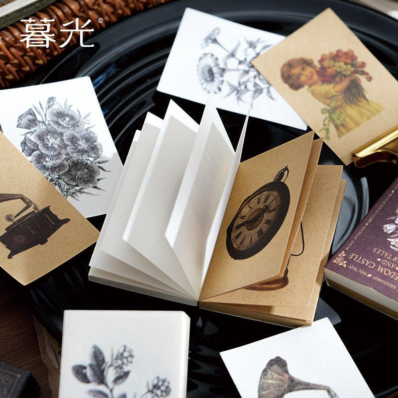 StationeryHaul vintage-style sticker book with botanical, clock, and portrait illustrations for journal decoration.