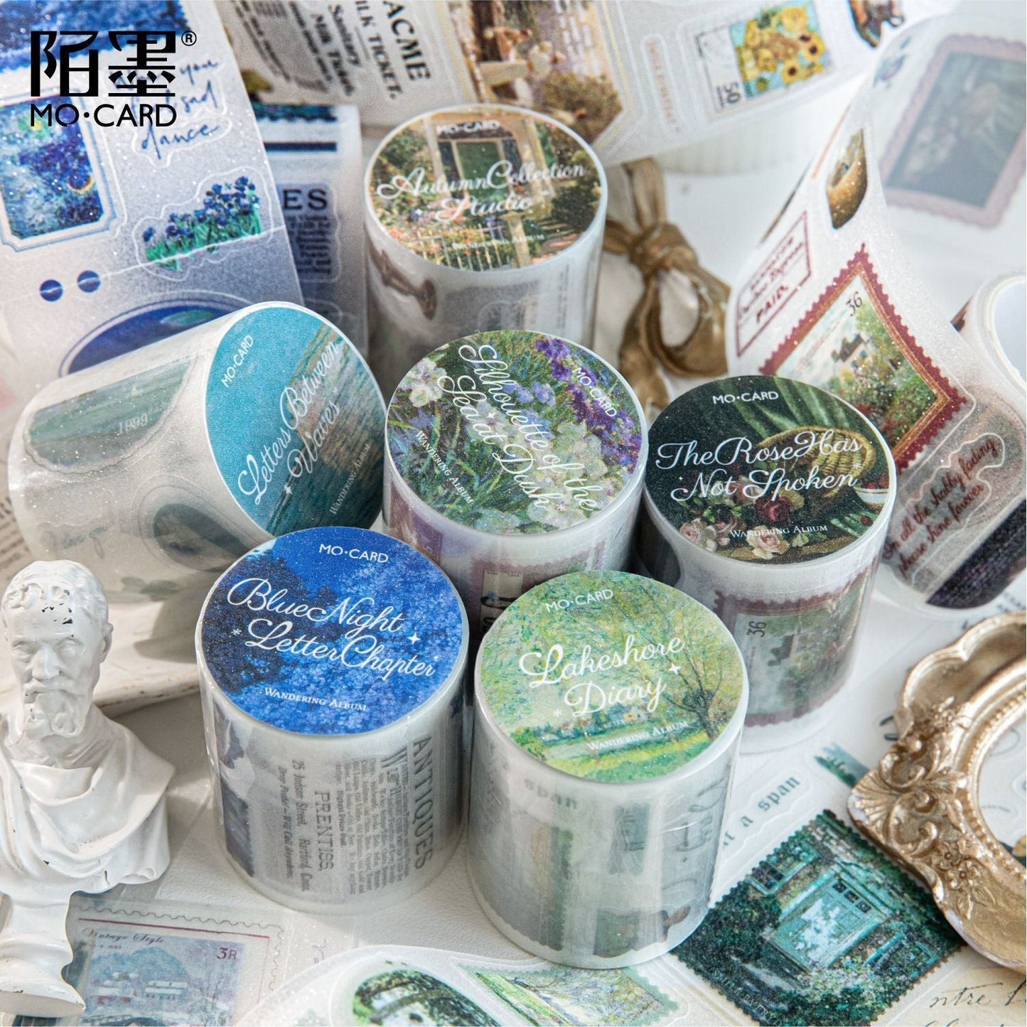 StationeryHaul vintage postage stamp and landscape decorative washi tape collection with blue, green, and floral designs.
