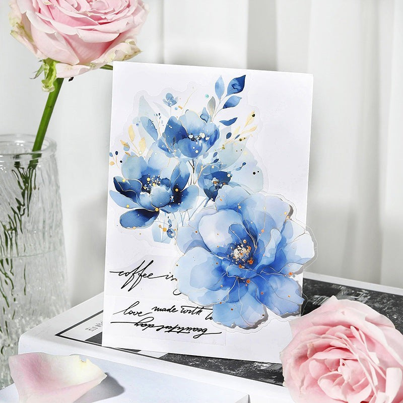 StationeryHaul watercolor floral stickers in blue hues with gold foil accents on a card. Delicate, translucent, waterproof.