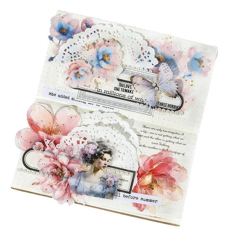 StationeryHaul watercolor floral stickers with gold foil accents, featuring pink, blue, and purple blooms, a vintage woman, and a butterfly on a journal page.