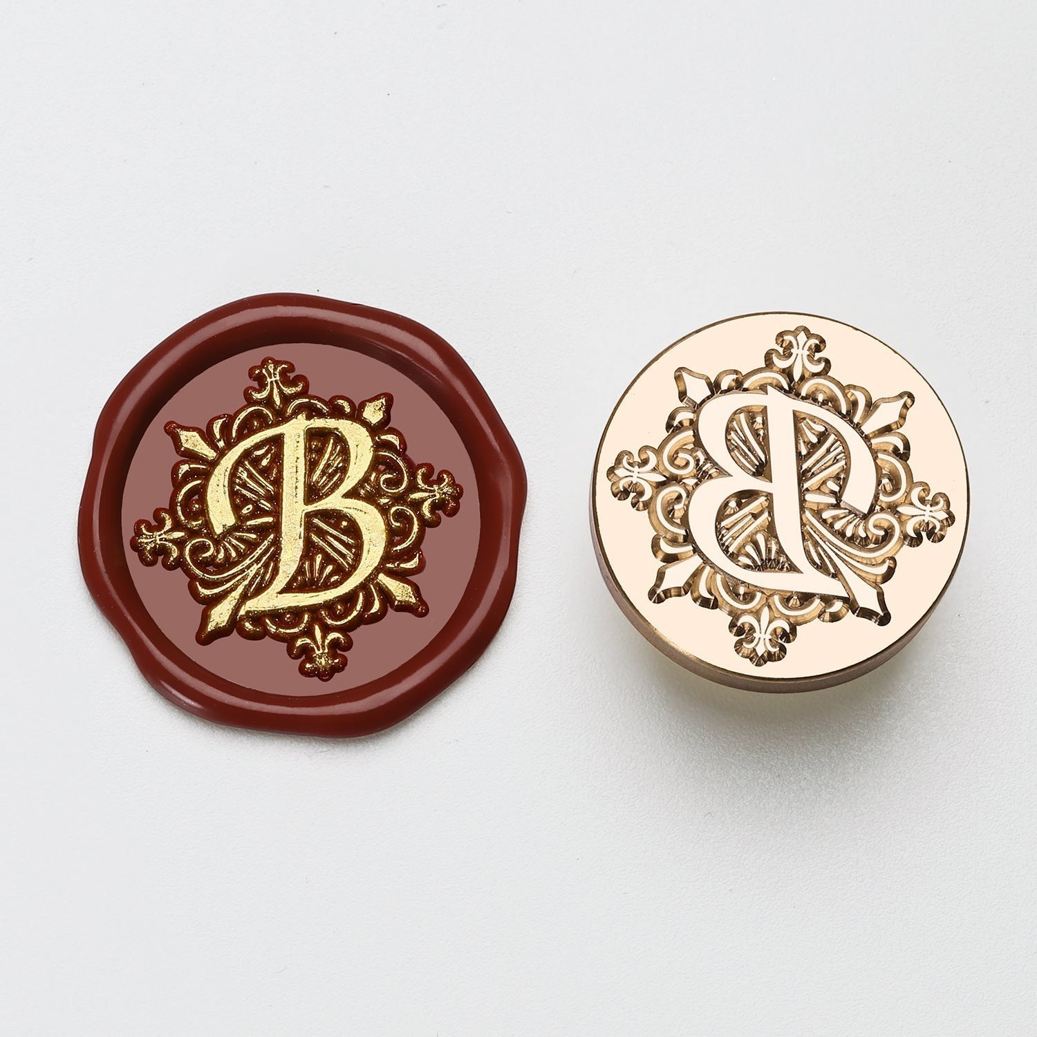 StationeryHaul elegant letter B wax seal stamp with ornate gold detailing on burgundy wax and brass stamp.