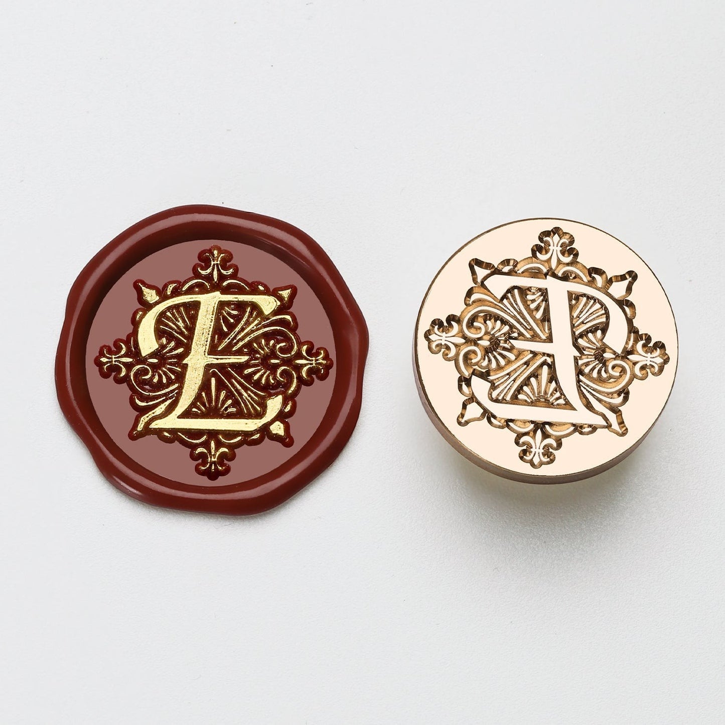 StationeryHaul elegant letter E wax seal stamp with ornate gold details on burgundy wax and brass stamp.
