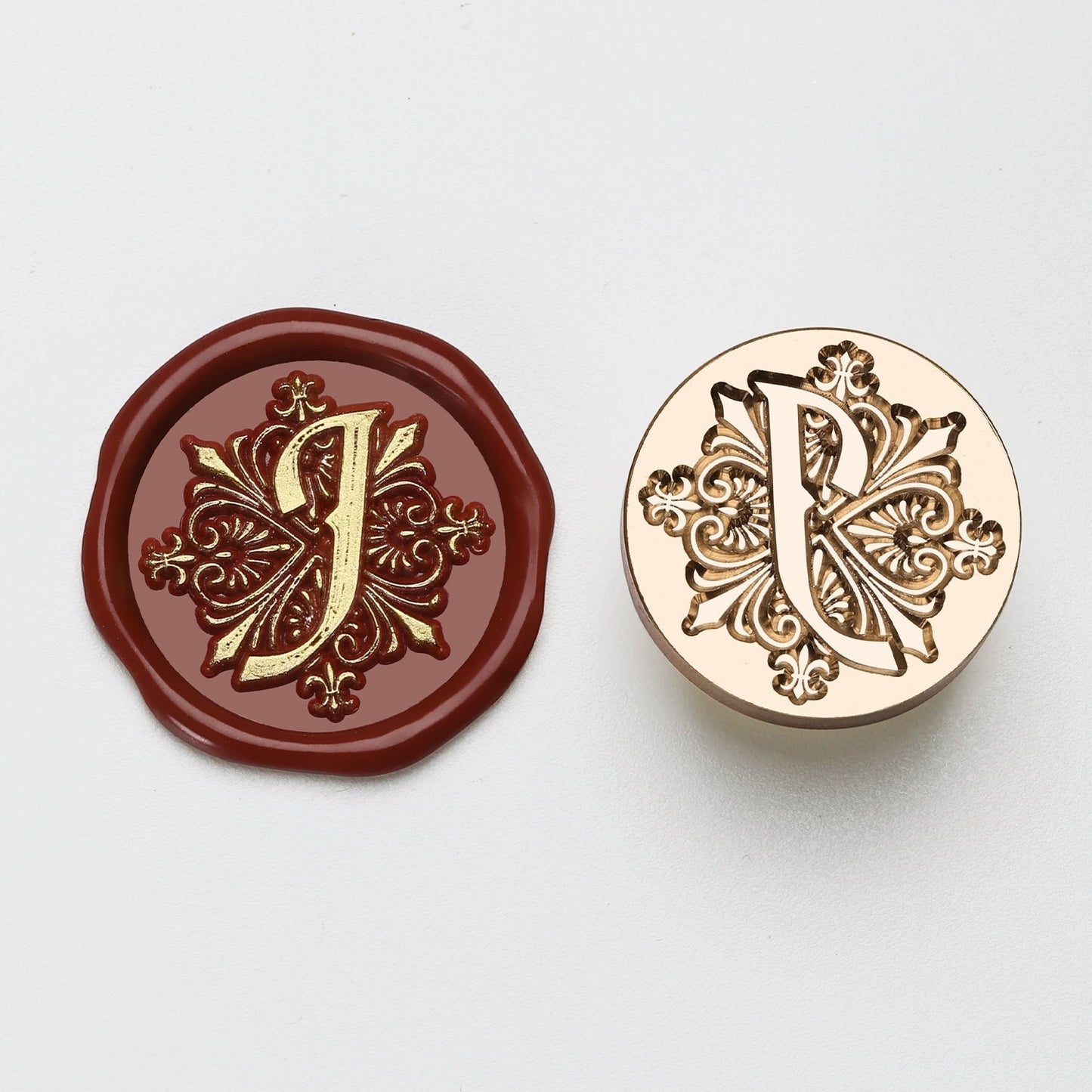 StationeryHaul elegant letter J wax seal stamp with ornate gold details on burgundy wax and brass metal.