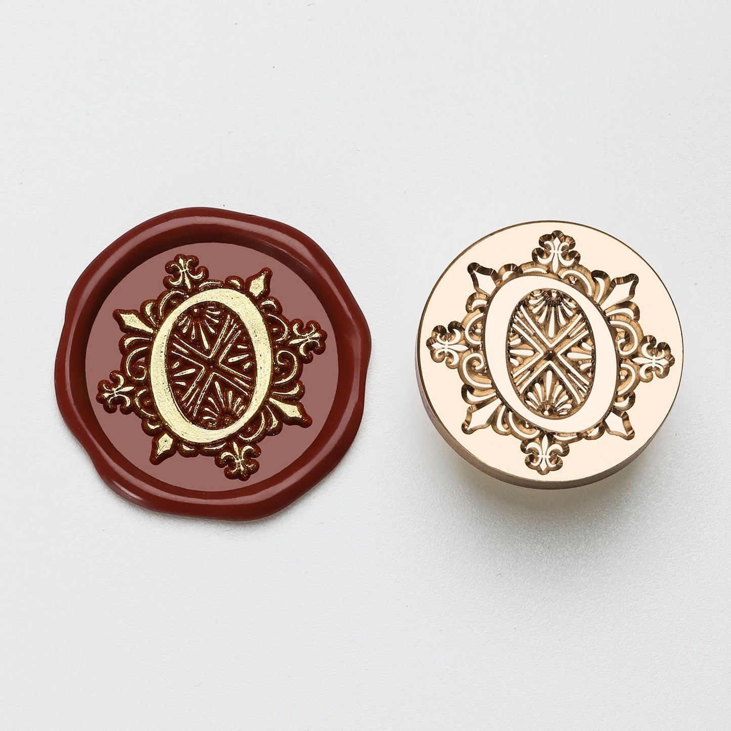 StationeryHaul elegant letter O wax seal stamp with ornate details on burgundy wax and brass stamp.