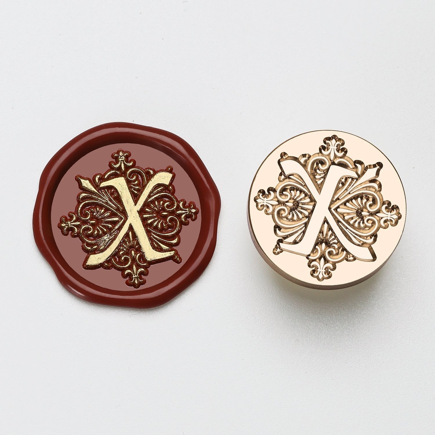 StationeryHaul elegant letter X wax seal stamp with ornate gold detailing on burgundy wax and brass stamp.